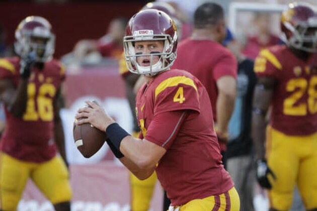 FILE - In this Oct. 8, 2015, file photo, Southern California quarterback Max Browne warms up before an NCAA college football game against Washington, in Los Angeles, Calif. (AP Photo/Jae C. Hong, File)