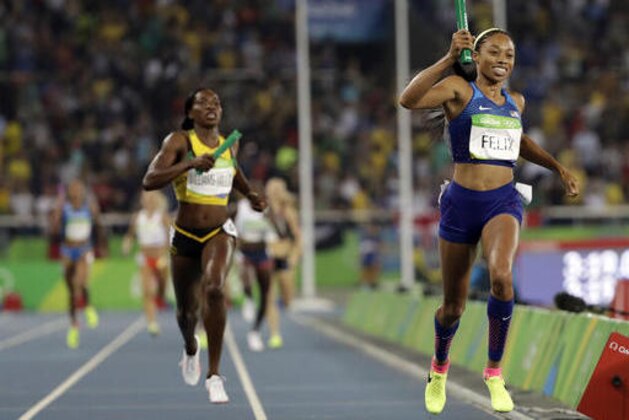 United States' Allyson Felix crosses the line to win the gold medal in the women's 4x400-meter relay final during the athletics competitions of the 2016 Summer Olympics at the Olympic stadium in Rio de Janeiro, Brazil, Saturday, Aug. 20, 2016. (AP Photo/David J. Phillip)