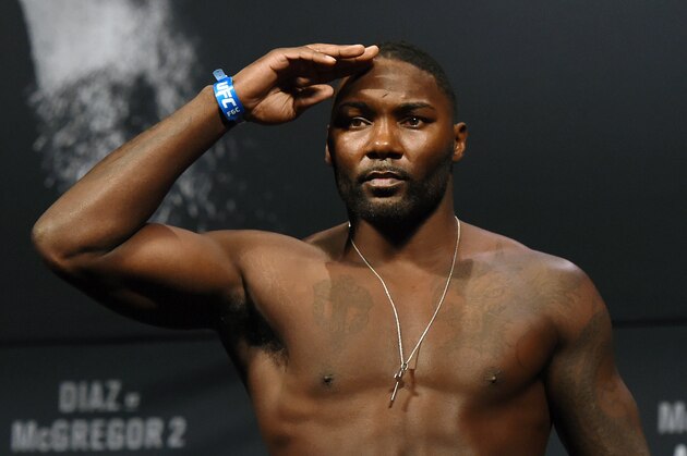 LAS VEGAS, NV - AUGUST 19:  Mixed martial artist Anthony Johnson salutes as he poses on the scale during his weigh-in for UFC 202 at MGM Grand Conference Center on August 19, 2016 in Las Vegas, Nevada. Johnson will meet Glover Teixeira in a light heavyweight bout on August 20, 2016, at T-Mobile Arena in Las Vegas.  (Photo by Ethan Miller/Getty Images)