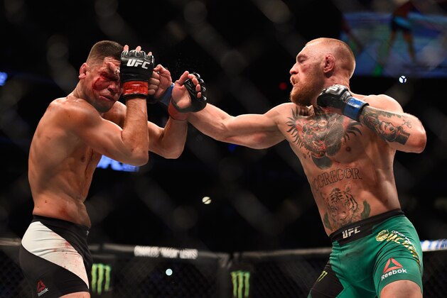 LAS VEGAS, NV - AUGUST 20:  Nate Diaz fights Conor McGregor of Ireland in their welterweight bout during the UFC 202 event at T-Mobile Arena on August 20, 2016 in Las Vegas, Nevada.  (Photo by Jeff Bottari/Zuffa LLC/Zuffa LLC via Getty Images)