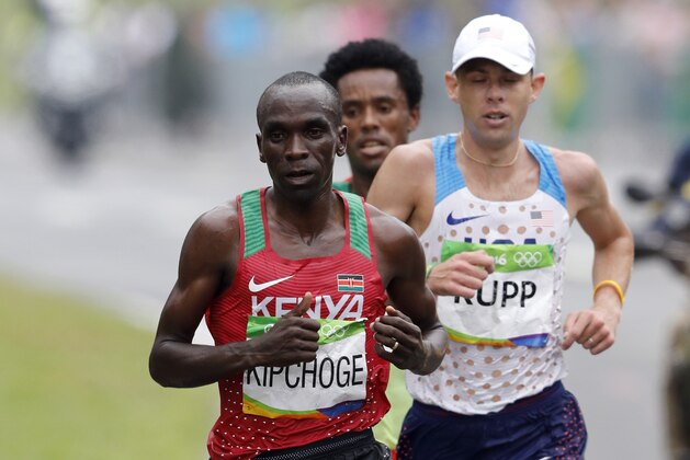 Kenya's Eliud Kipchoge and US Galen Rupp run during the Men's Marathon athletics event at the Rio 2016 Olympic Games in Rio de Janeiro on August 21, 2016.   / AFP / Adrian DENNIS        (Photo credit should read ADRIAN DENNIS/AFP/Getty Images)