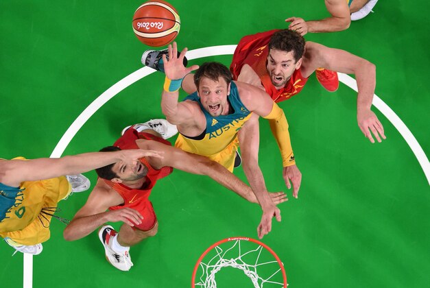 Aug 21, 2016; Rio de Janeiro, Brazil; Australia center David Andersen (13) and Spain center Pau Gasol (4) go for a rebound in the men's basketball bronze medal match during the Rio 2016 Summer Olympic Games at Carioca Arena 1. Mandatory Credit: USA TODAY Sports