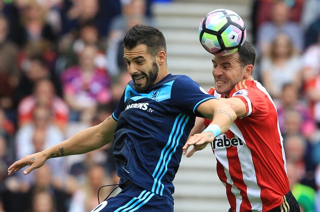 Middlesbrough's Spanish striker Alvaro Negredo (L) vies with Sunderland's Irish defender John O'Shea during the English Premier League football match between Sunderland and Middlesbrough at the Stadium of Light in Sunderland, north-east England on August 21, 2016 / AFP / Lindsey PARNABY / RESTRICTED TO EDITORIAL USE. No use with unauthorized audio, video, data, fixture lists, club/league logos or 'live' services. Online in-match use limited to 75 images, no video emulation. No use in betting, games or single club/league/player publications.  /         (Photo credit should read LINDSEY PARNABY/AFP/Getty Images)