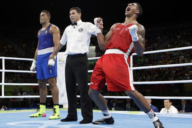 France's Tony Victor James Yoka, right, reacts as he won the gold medal for the men's super heavyweight over 91-kg boxing against Britain's Joe Joyce at the 2016 Summer Olympics in Rio de Janeiro, Brazil, Sunday, Aug. 21, 2016. (AP Photo/Frank Franklin II)