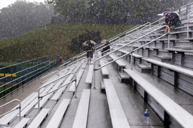 Fans wait in the grandstands at the Little League World Series tournament in South Williamsport, Pa., Sunday, Aug. 21, 2016. All Sunday games have been postponed due to rain and will resume Monday. (AP Photo/Gene J. Puskar)