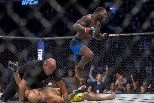 Aug 20, 2016; Las Vegas, NV, USA; Glover Teixeria (blue gloves) reacts during fight against  Anthony Johnson (red gloves) during UFC 202 at T-Mobile Arena. Mandatory Credit: Joshua Dahl-USA TODAY Sports