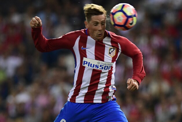 Atletico Madrid's forward Fernando Torres heads the ball during the Spanish league football match Club Atletico de Madrid vs Deportivo Alaves at the Vicente Calderon stadium in Madrid on Ausgut 21, 2016. / AFP / PIERRE-PHILIPPE MARCOU        (Photo credit should read PIERRE-PHILIPPE MARCOU/AFP/Getty Images)