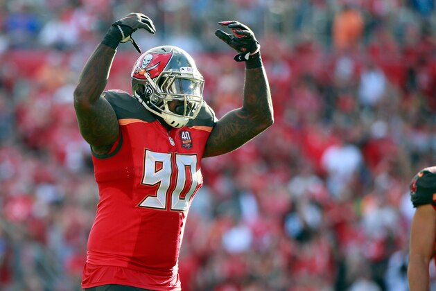 Dec 13, 2015; Tampa, FL, USA; Tampa Bay Buccaneers defensive tackle Henry Melton (90) reacts as he pumps up the crowd during the second half at Raymond James Stadium. New Orleans Saints defeated the Tampa Bay Buccaneers 24-17. Mandatory Credit: Kim Klement-USA TODAY Sports
