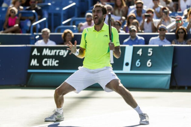 Marin Cilic, of Croatia, celebrates after defeating Andy Murray, of Britain, during the finals of the Western & Southern Open tennis tournament, Sunday, Aug. 21, 2016, in Mason, Ohio. (AP Photo/John Minchillo)