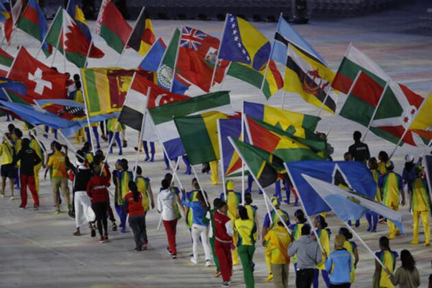 Flag bearers walk into the stadium during the closing ceremony for the Summer Olympics in Rio de Janeiro, Brazil, Sunday, Aug. 21, 2016. (AP Photo/Vincent Thian)
