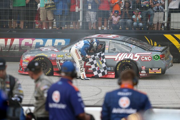 BRISTOL, TN - AUGUST 21: Kevin Harvick, driver of the #4 Busch Beer Chevrolet, speaks to Tony Stewart, driver of the #14 Haas Automation Chevrolet, after winning  the NASCAR Sprint Cup Series Bass Pro Shops NRA Night Race at Bristol Motor Speedway on August 21, 2016 in Bristol, Tennessee. The race was delayed due to inclement weather on Saturday, August 20.  (Photo by Rey Del Rio/Getty Images)