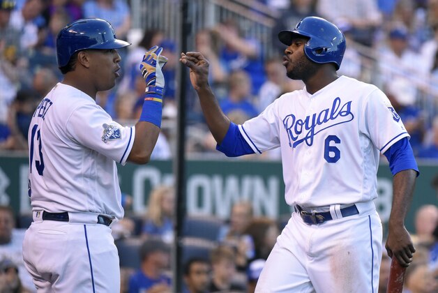 KANSAS CITY, MO - AUGUST 20:  Lorenzo Cain #6 of the Kansas City Royals celebrates with Salvador Perez #13 after scoring on a Eric Hosmer #35 single in the fifth inning against the Minnesota Twins Kauffman Stadium on August 20, 2016 in Kansas City, Missouri. (Photo by Ed Zurga/Getty Images)