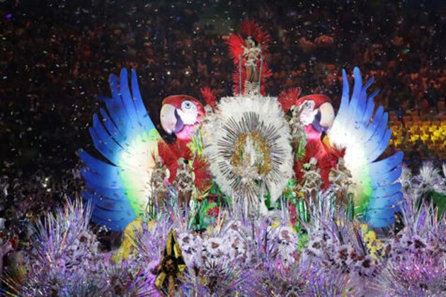 Plumed figures appear as part of the closing ceremony in the Maracana stadium at the 2016 Summer Olympics in Rio de Janeiro, Brazil, Sunday, Aug. 21, 2016. (AP Photo/Mark Humphrey)