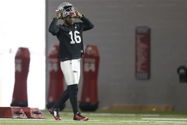 FILE - In this March 8, 2016, file photo, Ohio State quarterback J.T. Barrett is shown during their Spring NCAA college football practice in Columbus, Ohio. FILE - In this March 8, 2016, file photo, Ohio State quarterback J.T. Barrett is shown during their Spring NCAA college football practice in Columbus, Ohio.