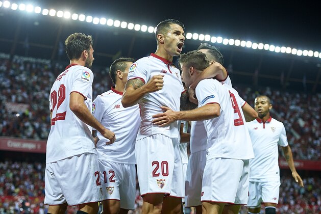 SEVILLE, SPAIN - AUGUST 20:  Luciano Vietto of Sevilla FC celebrates after scoring with his tea mate Victor Machin Perez 'Vitolo'during the match between Sevilla FC vs RCD Espanyol as part of La Liga at Estadio Ramon Sanchez Pizjuan on August 20, 2016 in Seville, Spain.  (Photo by Aitor Alcalde/Getty Images)