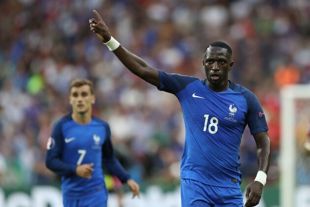 France's midfielder Moussa Sissoko gestures next to France's forward Antoine Griezmann during the Euro 2016 final football match between Portugal and France at the Stade de France in Saint-Denis, north of Paris, on July 10, 2016. / AFP / Valery HACHE        (Photo credit should read VALERY HACHE/AFP/Getty Images)