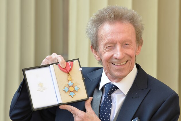 LONDON, UNITED KINGDOM - MARCH 11: Former Scotland and Manchester United footballer Denis Law poses with his  Commander of the Order of the British Empire (CBE) medal that was presented to him by the Duke of Cambridge during an Investiture ceremony at Buckingham Palace on March 11, 2016 in London, United Kingdom. (Photo by John Stillwell - WPA Pool/Getty Images)