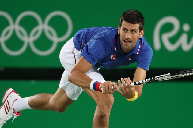 Aug 7, 2016; Rio de Janeiro, Brazil; Novak Djokovic (SRB) hits a forehand against Juan Martin Del Potro (ARG, not pictured) during the men's singles in the Rio 2016 Summer Olympic Games at Olympic Tennis Centre. Mandatory Credit: Jeff Swinger-USA TODAY Sports