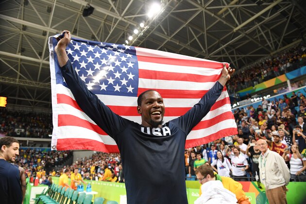RIO DE JANEIRO, BRAZIL - AUGUST 21:  Kevin Durant #5 of the USA Basketball Men's National Team celebrates after winning the Gold Medal Game against Serbia on Day 16 of the Rio 2016 Olympic Games at Carioca Arena 1 on August 21, 2016 in Rio de Janeiro, Brazil. NOTE TO USER: User expressly acknowledges and agrees that, by downloading and/or using this Photograph, user is consenting to the terms and conditions of the Getty Images License Agreement. Mandatory Copyright Notice: Copyright 2016 NBAE (Photo by Jesse D. Garrabrant/NBAE via Getty Images)