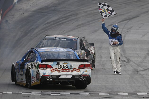 BRISTOL, TN - AUGUST 21:  Kevin Harvick, driver of the #4 Busch Beer Chevrolet, celebrates with the checkered flag after winning the NASCAR Sprint Cup Series Bass Pro Shops NRA Night Race at Bristol Motor Speedway on August 21, 2016 in Bristol, Tennessee. The race was delayed due to inclement weather on Saturday, August 20.  (Photo by Brian Lawdermilk/Getty Images)