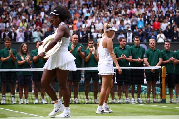 LONDON, ENGLAND - JULY 09:  Serena Williams of The United States and Angelique Kerber of Germany look on as they hold their trophies following The Ladies Singles Final on day twelve of the Wimbledon Lawn Tennis Championships at the All England Lawn Tennis and Croquet Club on July 9, 2016 in London, England.  (Photo by Clive Brunskill/Getty Images)
