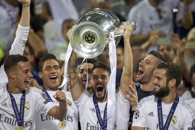 (L-R) Jese of Real Madrid, Raphael Varane of Real Madrid, Isco of Real Madrid with Champions League trophy, Coupe des clubs Champions Europeeens,  goalkeeper Kiko Casilla of Real Madrid, Nacho of Real Madrid during the UEFA Champions League final match between Real Madrid and Atletico Madrid on May 28, 2016 at the Giuseppe Meazza San Siro stadium in Milan, Italy.(Photo by VI Images via Getty Images)