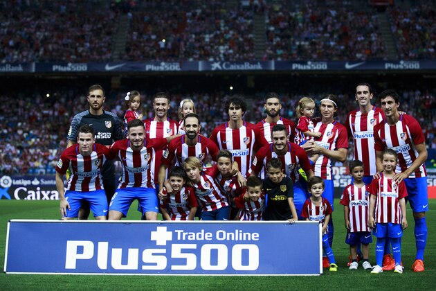 MADRID, SPAIN - AUGUST 21: Atletico de Madrid players line up with their children prior to start the La Liga match between Club Atletico de Madrid and Deportivo Alaves at Vicente Calderon stadium on August 21, 2016 in Madrid, Spain. (Photo by Gonzalo Arroyo Moreno/Getty Images)