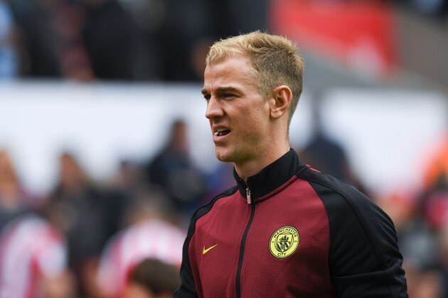 Manchester City's English goalkeeper Joe Hart walks to the dressing room at half time during the English Premier League football match between Stoke City and Manchester City at the Bet365 Stadium in Stoke-on-Trent, central England on August 20, 2016. / AFP / Paul ELLIS / RESTRICTED TO EDITORIAL USE. No use with unauthorized audio, video, data, fixture lists, club/league logos or 'live' services. Online in-match use limited to 75 images, no video emulation. No use in betting, games or single club/league/player publications.  /         (Photo credit should read PAUL ELLIS/AFP/Getty Images)