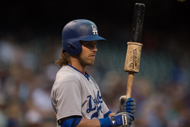 DENVER, CO - AUGUST 4:   Josh Reddick #11 of the Los Angeles Dodgers looks on front he on deck circle in the first inning of a game at Coors Field on August 4, 2016 in Denver, Colorado.  (Photo by Dustin Bradford/Getty Images)