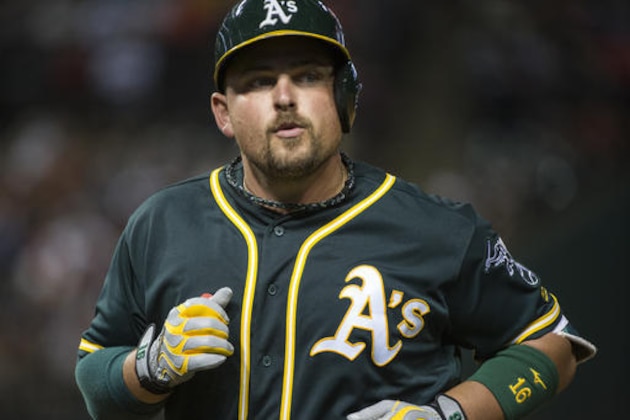 Oakland Athletics' Billy Butler heads back to the dugout after flying out against the Cleveland Indians during the ninth inning of a baseball game in Cleveland, Saturday, July 30, 2016. (AP Photo/Phil Long)