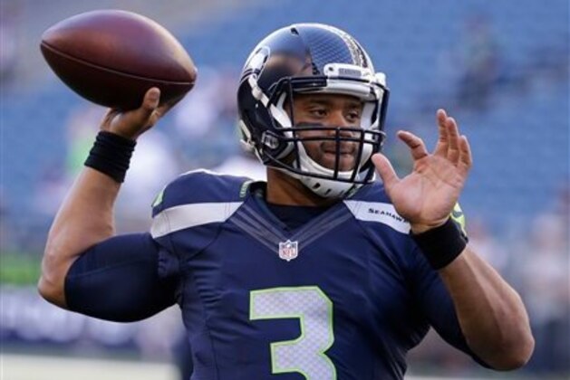 Seattle Seahawks quarterback Russell Wilson passes during warmups before a preseason NFL football game against the Minnesota Vikings, Thursday, Aug. 18, 2016, in Seattle. (AP Photo/Elaine Thompson)