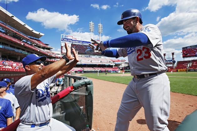 CINCINNATI, OH - AUGUST 22: Adrian Gonzalez #23 of the Los Angeles Dodgers celebrates with manager Dave Roberts after hitting a three-run home run in the seventh inning for his third homer of the game against the Cincinnati Reds at Great American Ball Park on August 22, 2016 in Cincinnati, Ohio. (Photo by Joe Robbins/Getty Images)