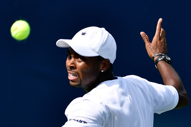 WINSTON SALEM, NC - AUGUST 22:  Donald Young of the United States returns a shot to Pierre-Hugues Herbert of France during the Winston-Salem Open at Wake Forest University on August 22, 2016 in Winston Salem, North Carolina.  (Photo by Grant Halverson/Getty Images)