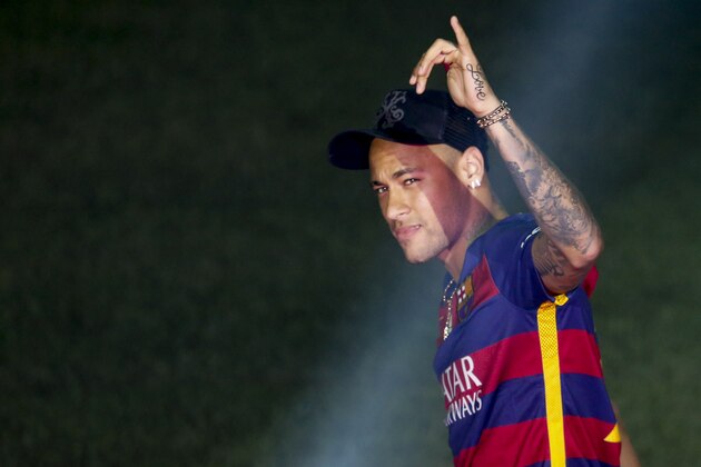 Barcelona's Brazilian forward Neymar acknowledges the crowd during celebrations at the Camp Nou stadium in Barcelona on May 23, 2016 following their Spanish 'Copa del Rey' (King's Cup) final football match 2-0 victory over Sevilla FC yesterday also marking the club's 28th Copa del Rey win and the 24th Spanish Liga title. / AFP / PAU BARRENA (Photo credit should read PAU BARRENA/AFP/Getty Images) Barcelona's Brazilian forward Neymar acknowledges the crowd during celebrations at the Camp Nou stadium in Barcelona on May 23, 2016 following their Spanish 'Copa del Rey' (King's Cup) final football match 2-0 victory over Sevilla FC yesterday also marking the club's 28th Copa del Rey win and the 24th Spanish Liga title. / AFP / PAU BARRENA (Photo credit should read PAU BARRENA/AFP/Getty Images)