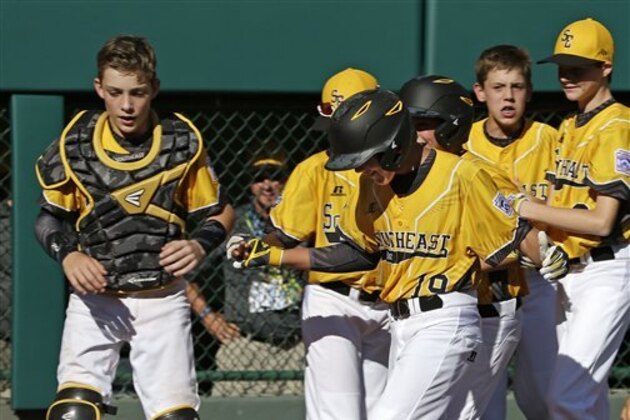 Goodlettsville, Tenn.'s Zach McWilliams (19) celebrate with teammates after hitting a solo home run during the sixth inning of a baseball game against Endwell, New York in United States pool play at the Little League World Series tournament in South Williamsport, Pa., Monday, Aug. 22, 2016. New York won 3-1.(AP Photo/Gene J. Puskar)
