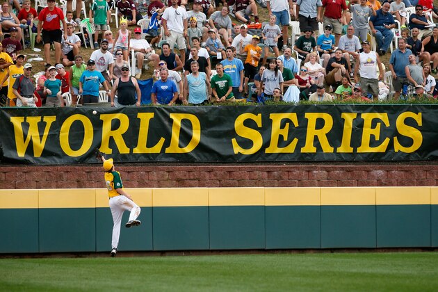 SOUTH WILLAMSPORT, PA - AUGUST 25: Bradley Smith #26 of  West team from Petaluma, California misses catching a three run homer off the bat of Lorenzo Butler #8 of the Southeast team from Goodlettsville, Tennessee during the fourth inning of their Little League World Series game on August 25, 2012 in South Willamsport, Pennsylvania.  (Photo by Rob Carr/Getty Images)