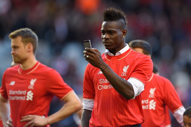 LIVERPOOL, ENGLAND - MAY 16:  Mario Balotelli of Liverpool takes pictures of the fans on his phone after the Barclays Premier League match betrween Liverpool and Crystal Palace at Anfield on May 16, 2015 in Liverpool, England.  (Photo by Stu Forster/Getty Images)