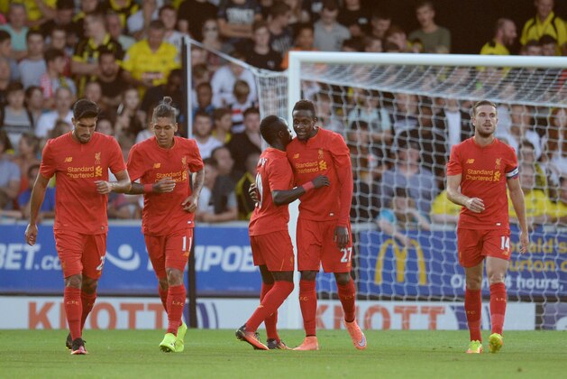 Liverpool's Belgian striker Divock Origi (CR) is congratulated by Liverpool's Senegalese midfielder Sadio Mane (CL) after scoring the opening goal during the English League Cup second round football match between Burton Albion and Liverpool at the Pirelli Stadium in Burton-on-Trent, central England on August 23, 2016. / AFP / OLI SCARFF / RESTRICTED TO EDITORIAL USE. No use with unauthorized audio, video, data, fixture lists, club/league logos or 'live' services. Online in-match use limited to 75 images, no video emulation. No use in betting, games or single club/league/player publications.  /         (Photo credit should read OLI SCARFF/AFP/Getty Images)