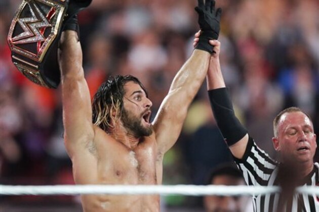 WWE Superstar Seth Rollins celebrates becoming the new WWE World Heavyweight Champion at WrestleMania 31 at Levi's Stadium on Sunday, March 29, 2015 in Santa Clara, CA. WrestleMania broke the Levi’s Stadium attendance record at 76,976 fans from all 50 states and 40 countries. (Don Feria/AP Images for WWE)