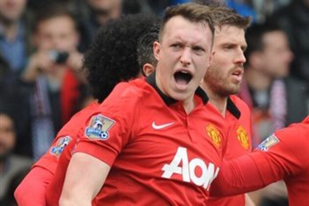 Manchester United's Phil Jones celebrates after scoring against West Brom during the English Premier League soccer match between West Bromwich Albion and Manchester United at The Hawthorns Stadium in West Bromwich, England, Saturday, March 8, 2014. (AP Photo/Rui Vieira)