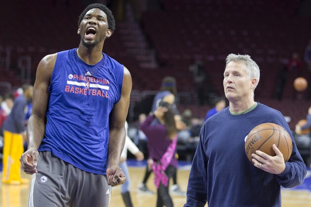 PHILADELPHIA, PA - FEBRUARY 20: Head coach Brett Brown of the Philadelphia 76ers works with Joel Embiid #21 prior to the game against the Indiana Pacers on February 20, 2015 at the Wells Fargo Center in Philadelphia, Pennsylvania. NOTE TO USER: User expressly acknowledges and agrees that, by downloading and or using this photograph, User is consenting to the terms and conditions of the Getty Images License Agreement (Photo by Mitchell Leff/Getty Images)