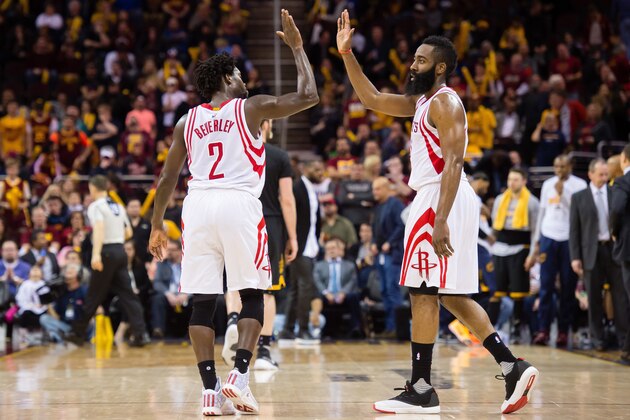 CLEVELAND, OH - MARCH 29: Patrick Beverley #2 and James Harden #13 of the Houston Rockets celebrate during the final seconds of the second half against the Cleveland Cavaliers at Quicken Loans Arena on March 29, 2016 in Cleveland, Ohio. The Rockets defeated the Cavaliers 106-100. NOTE TO USER: User expressly acknowledges and agrees that, by downloading and/or using this photograph, user is consenting to the terms and conditions of the Getty Images License Agreement. Mandatory copyright notice. (Photo by Jason Miller/Getty Images)