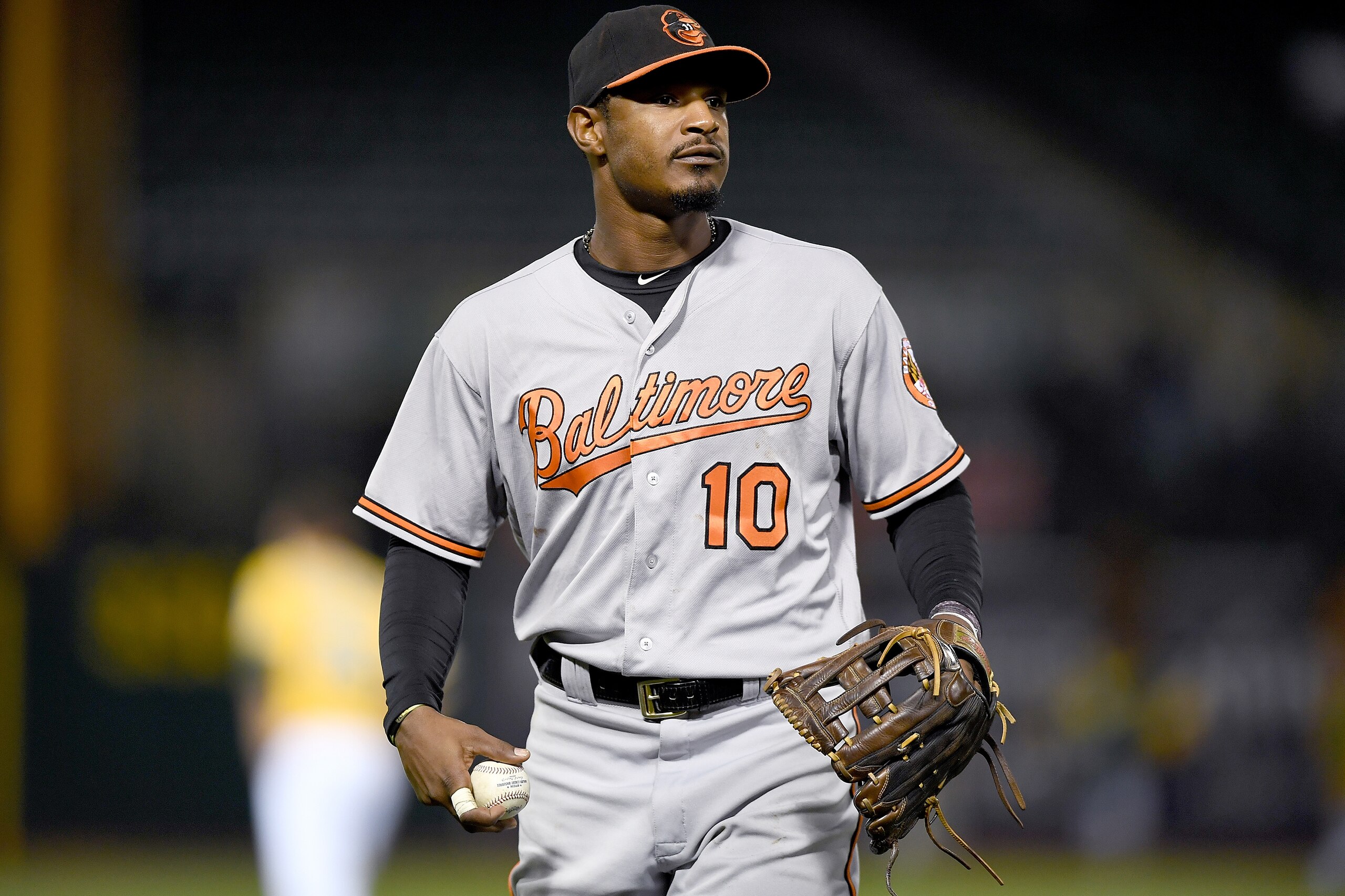 OAKLAND, CA - AUGUST 10:  Adam Jones #10 of the Baltimore Orioles looks for a fan to throw the ball to at the end of the six inning against the Oakland Athletics at the Oakland Coliseum on August 10, 2016 in Oakland, California.  (Photo by Thearon W. Henderson/Getty Images)