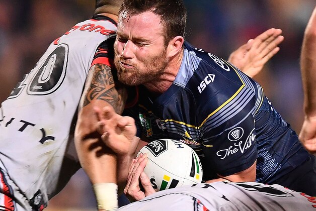 TOWNSVILLE, AUSTRALIA - AUGUST 20:  Gavin Cooper of the Cowboys is tackled by Albert Vete of the Warriors  during the round 24 NRL match between the North Queensland Cowboys and the New Zealand Warriors at 1300SMILES Stadium on August 20, 2016 in Townsville, Australia.  (Photo by Ian Hitchcock/Getty Images)