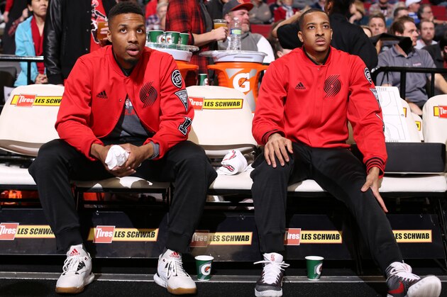 PORTLAND, OR - MARCH 23:  Damian Lillard #0 and C.J. McCollum #3 of the Portland Trail Blazers sit on the bench before the game against the Dallas Mavericks on March 23, 2016 at the Moda Center Arena in Portland, Oregon. NOTE TO USER: User expressly acknowledges and agrees that, by downloading and or using this photograph, user is consenting to the terms and conditions of the Getty Images License Agreement. Mandatory Copyright Notice: Copyright 2016 NBAE (Photo by Sam Forencich/NBAE via Getty Images)