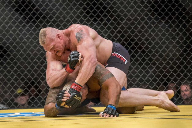 Jul 9, 2016; Las Vegas, NV, USA; Mark Hunt (blue gloves) is elbowed by Brock Lesnar (red gloves) during UFC 200 at T-Mobile Arena. Mandatory Credit: Joshua Dahl-USA TODAY Sports Jul 9, 2016; Las Vegas, NV, USA; Mark Hunt (blue gloves) is elbowed by Brock Lesnar (red gloves) during UFC 200 at T-Mobile Arena. Mandatory Credit: Joshua Dahl-USA TODAY Sports