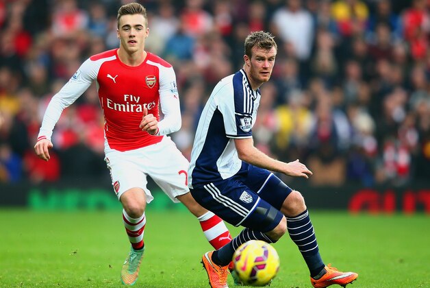 WEST BROMWICH, ENGLAND - NOVEMBER 29: Chris Brunt of West Brom and Calum Chambers of Arsenal compete for the ball  during the Barclays Premier League match between West Bromwich Albion and Arsenal at The Hawthorns on November 29, 2014 in West Bromwich, England  (Photo by Mark Thompson/Getty Images)