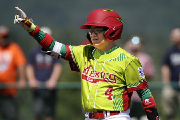 Mexico's Diego Cantu celebrates as he stands on second base after driving in two runs with a double off Australia's Harrison Wheeldon during the third inning of an International elimination baseball game at the Little League World Series tournament in South Williamsport, Pa., Wednesday, Aug. 24, 2016. (AP Photo/Gene J. Puskar)