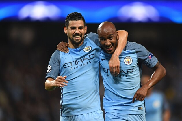 Manchester City's English midfielder Fabian Delph (R) celebrates scoring the opening goal with Manchester City's Spanish midfielder Nolito (L) during the UEFA Champions League second leg play-off football match between Manchester City and Steaua Bucharest at the Etihad Stadium in Manchester, north west England on August 24, 2016. / AFP / Anthony Devlin        (Photo credit should read ANTHONY DEVLIN/AFP/Getty Images)