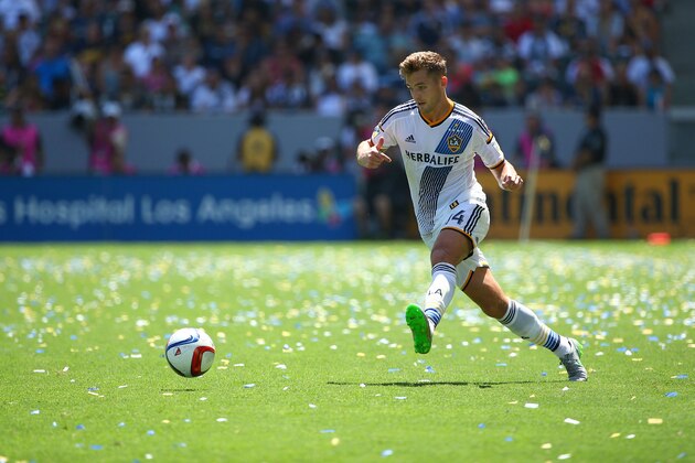 LOS ANGELES, CA - AUGUST 23:  Robbie Rogers #14 of Los Angeles Galaxy passes the ball during the MLS match against the New York City FC at StubHub Center on August 23, 2015 in Los Angeles, California. The Galaxy defeated NYCFC 5-1.  (Photo by Victor Decolongon/Getty Images)
